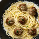 Garlic Butter Meatballs over Creamy Parmesan Linguine