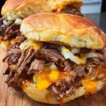 Crockpot Shredded Beef and Cheddar Sandwiches