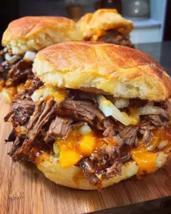 Crockpot Shredded Beef and Cheddar Sandwiches